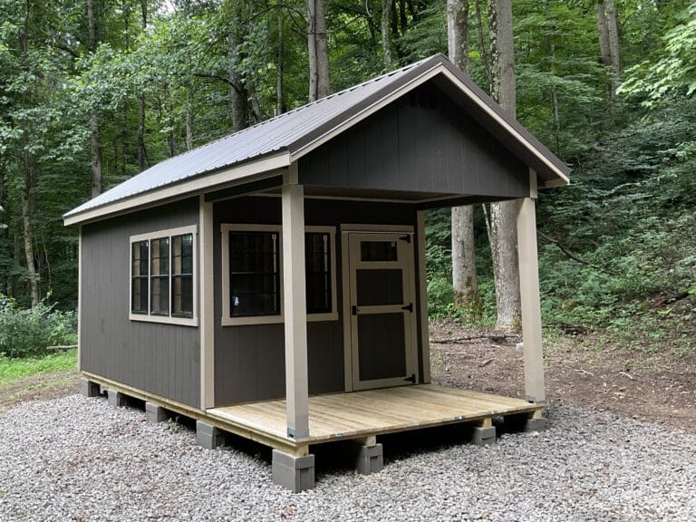 Chalet cabin shed with front porch and large windows