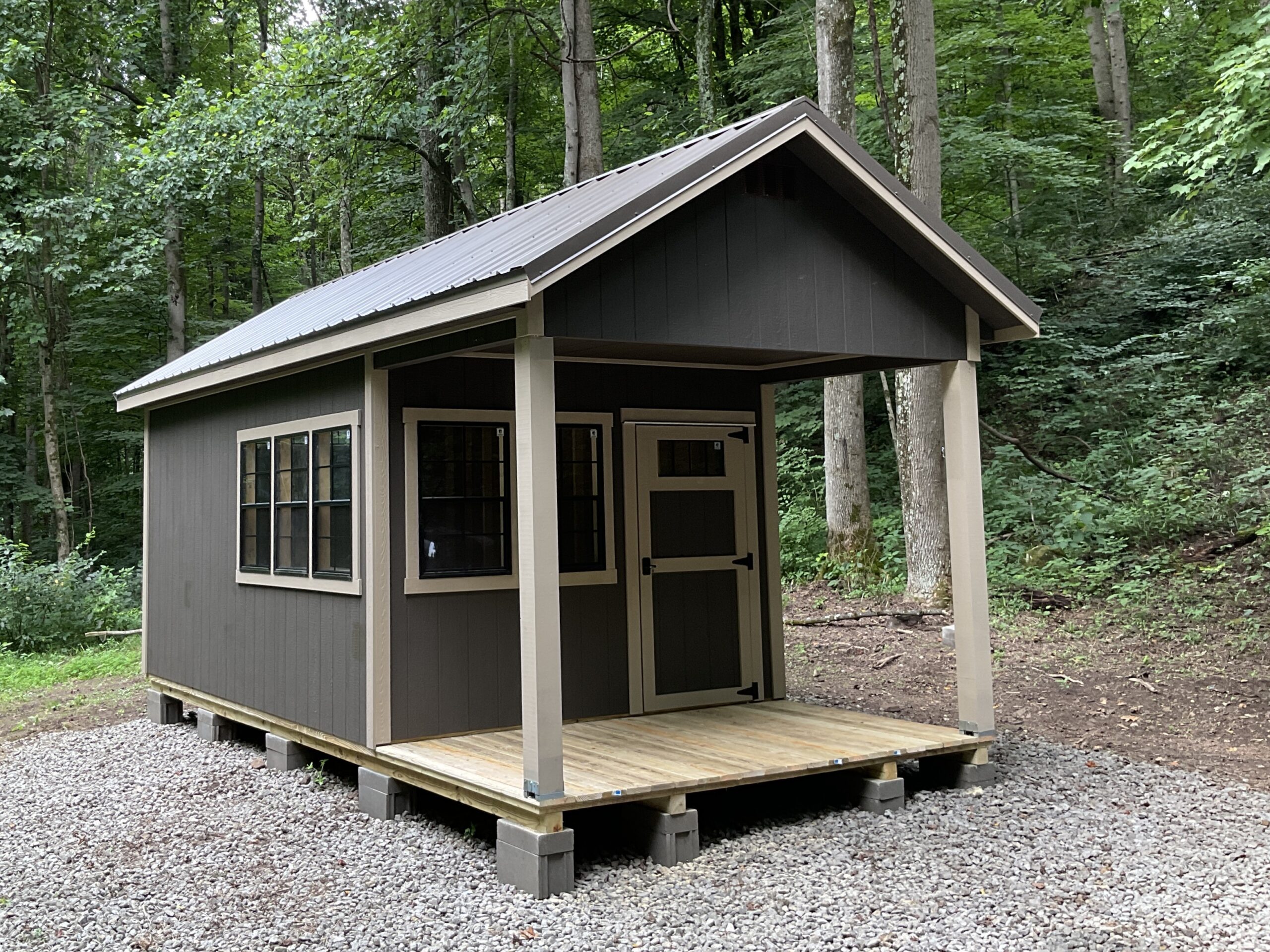 Chalet cabin shed with customized options, covered front porch and rustic design for sale in Ohio