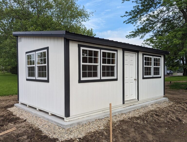 White Modern Studio shed with multiple front windows and black trim