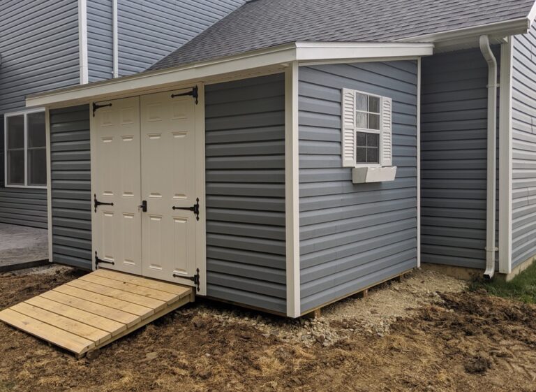 Gray Modern Studio shed with side entrance and composite deck