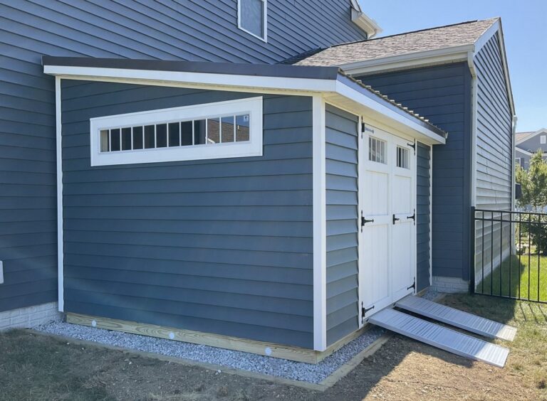 Blue Modern Studio shed with covered entrance and modern exterior