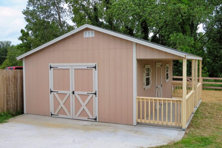 Tan cabin shed with double barn doors and front porch, available for sale in Ohio