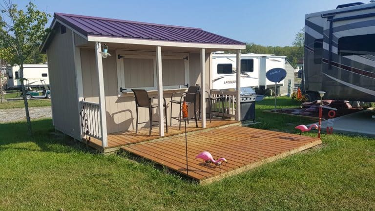 Cabin shed with front porch and backyard deck, available for sale in Ohio