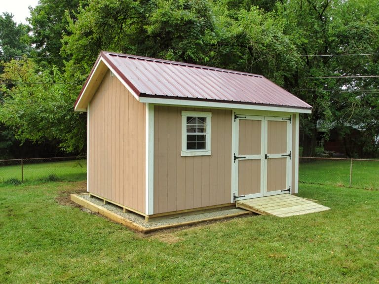 Tan A-frame storage shed for sale near Springfield, Ohio with green trim