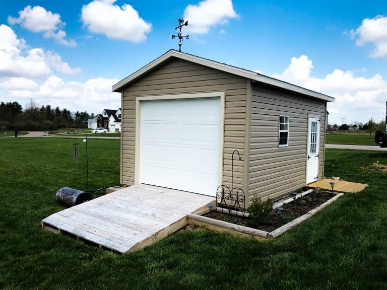 A-frame gable shed with roll-up garage door and side entry