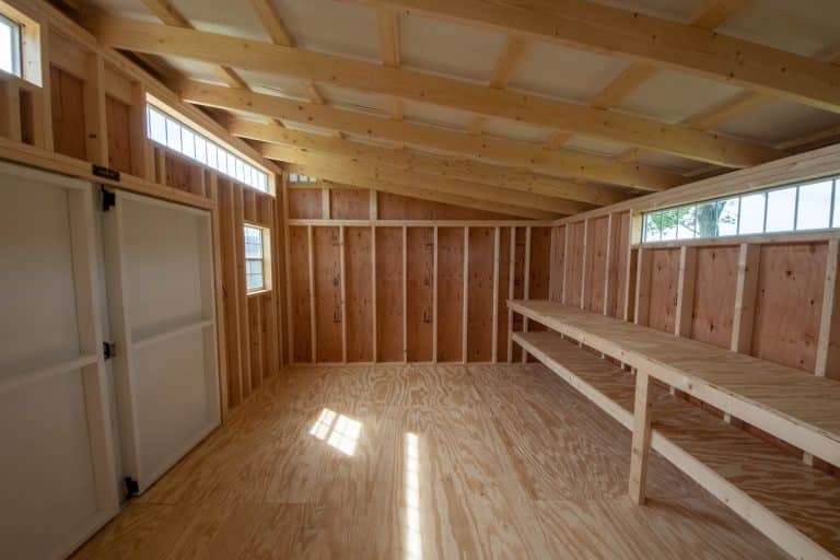 Finished interior of a Modern Studio shed with exposed wood framing in Ohio