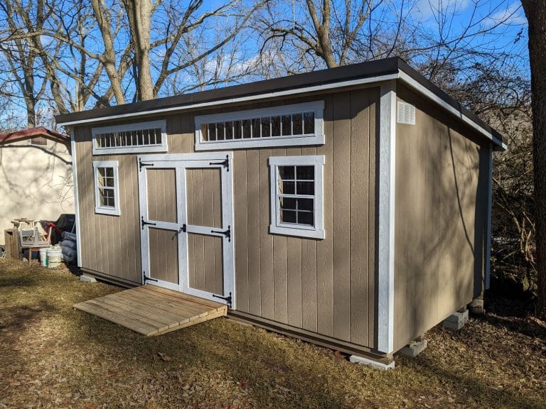 Rustic Modern Studio shed with porch and natural wood exterior