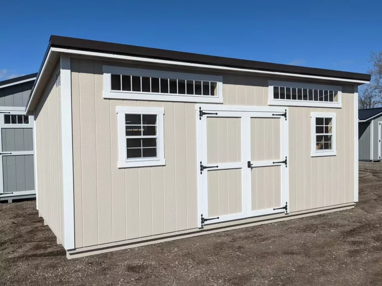 Beige Modern Studio shed with double barn doors and modern roofline