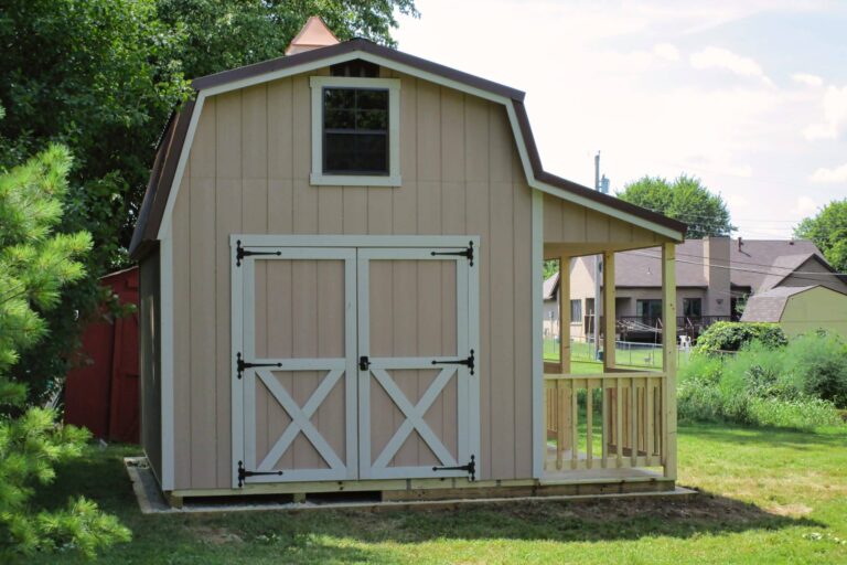 Tall loft-style shed with porch and barn doors