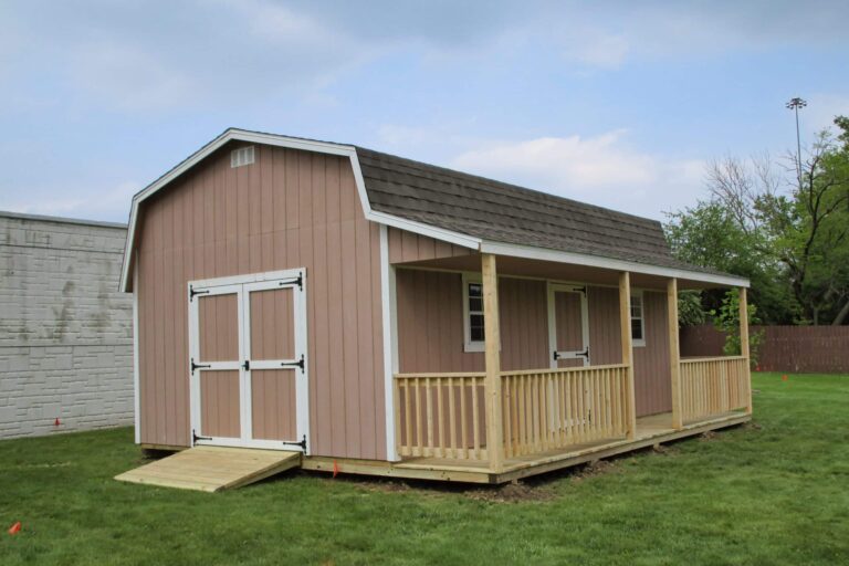 Brown shed with side porch and double barn doors, one of the sheds with porches