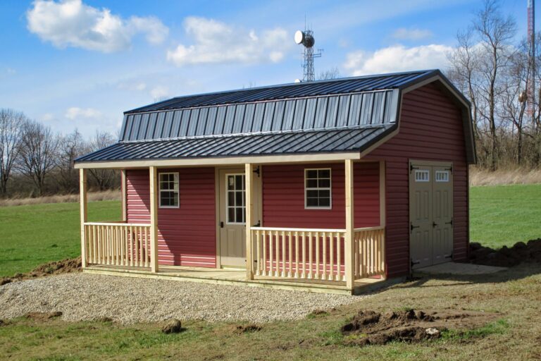 Red shed with covered porch and metal roof, one of the classic sheds with porches